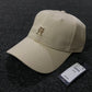 Tommy Hilfiger TH Monogram Plaque baseball cap in classic beige organic cotton with gold-tone hardware